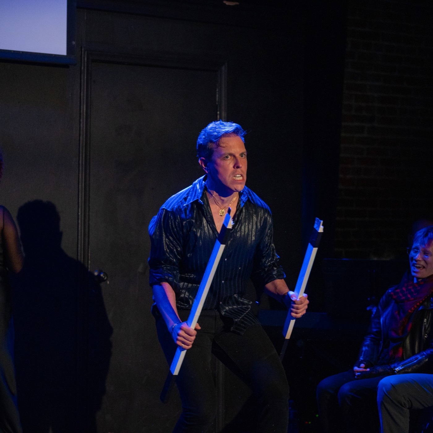 Ilya Rozanov breaking a hockey stick on stage